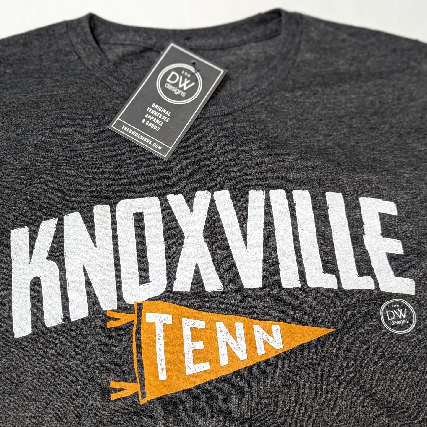The Knoxville Tenn Pennant Tee features Knoxville above an orange pennant that says Tenn. Sold by The DW Designs, Knoxville, TN.