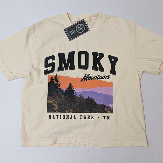 The Smoky Mountains Graphic Crop Tee features a colorful sunset in the Smoky Mountains National Park. Sold by The DW Designs, Knoxville, TN.